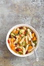 Minestrone soup. Vegetable soup with fresh tomato, celery, carrot, zucchini, onion, pepper, beans and pasta. Dish of italian cuisi Royalty Free Stock Photo