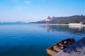 Ming Tombs Reservoir with the Imperial Summer Palace and a boat in sight in Beijing, China Royalty Free Stock Photo