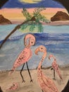 Mingling flamingos in the sand