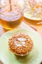 Mini Almond cake and tea on wooden table. selective focus