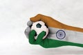 Mini ball of football in India flag painted hand on white background.