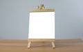 A mini blank whiteboard on wooden table