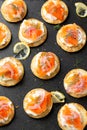 Mini blini pancakes with soft cheese, cold smoked salmon and dill Royalty Free Stock Photo