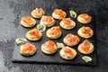 Mini blini pancakes with soft cheese, cold smoked salmon and dill Royalty Free Stock Photo