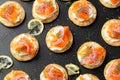 Mini blini pancakes with soft cheese, cold smoked salmon and dill Royalty Free Stock Photo