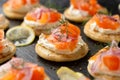 Mini blini pancakes with soft cheese, cold smoked salmon and dill Royalty Free Stock Photo