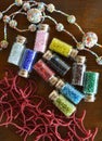 Mini bottles with beads and beaded handicrafts jewellery Royalty Free Stock Photo