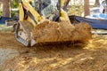 Mini bulldozer with earth doing landscaping works Royalty Free Stock Photo