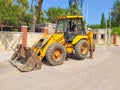 Mini bulldozer or excavation or loader on road. Royalty Free Stock Photo