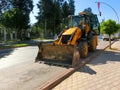 Mini bulldozer or excavation or loader on road. Royalty Free Stock Photo