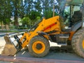 Mini bulldozer or excavation or loader on road. Royalty Free Stock Photo