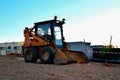 Mini bulldozer is gaining ground in the bucket Royalty Free Stock Photo