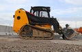 Mini bulldozer on a gravel road in a construction site o Royalty Free Stock Photo