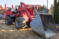 Mini bulldozer parked at the ouse for ground work Royalty Free Stock Photo