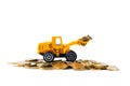 Mini bulldozer truck loading stack coin with pile of gold coin, Royalty Free Stock Photo