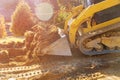 Mini bulldozer working with earth soil while doing landscaping works on construction Royalty Free Stock Photo