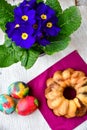 Bundt easter marble cake, easter eggs and Primrose - Primula vulgaris Royalty Free Stock Photo