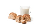 Mini buns and mug of milk isolated on white background