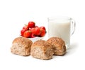 Mini buns and mug of milk with strawberries isolated on white b