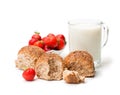 Mini buns and mug of milk with strawberries isolated on white b