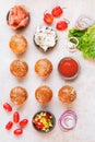 Mini burger buns topped with sesame seeds and various fillings Royalty Free Stock Photo