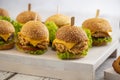 Mini burgers with cheese and lettuce Royalty Free Stock Photo