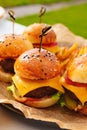 Mini burgers for a children's party or picnic. Royalty Free Stock Photo