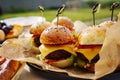 Mini burgers for a children's party or picnic. Royalty Free Stock Photo