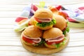 Mini burgers with ham and vegetables Royalty Free Stock Photo