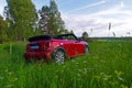 Mini cabrio during summertime parked in the grass Royalty Free Stock Photo