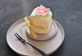 mini cake decorated with edible flowera ns leaves made of rice paper. sweet treat for autumn halloween selebration