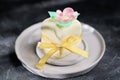 mini cake decorated with edible flowera ns leaves made of rice paper. sweet treat for autumn halloween selebration