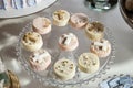 Mini cakes on the dessert table of the first communion Royalty Free Stock Photo