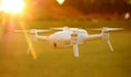 Mini Camera Drone Flying at Sunset Royalty Free Stock Photo