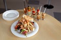 Mini Canape with meat and vegetables in glass cups. Chicken sandwiches