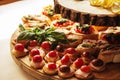 Mini canapes food.Beautiful decorat catering banquet wooden  table. Snacks and appetizers. Wedding celebration Royalty Free Stock Photo