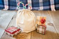 Mini canvas gift sack with candy canes sticking out the top, gif Royalty Free Stock Photo