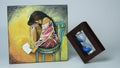 Mini canvas painting of a lonely lady with a sand watch at the side