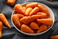 Mini chantenay carrots in a white bowl