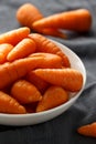 Mini chantenay carrots in a white bowl