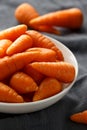 Mini chantenay carrots in a white bowl Royalty Free Stock Photo