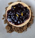 Mini cheese cake with roasted blubbery and buckwheat crumbs.