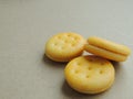 Mini cheese sandwich crackers on brown background. Royalty Free Stock Photo
