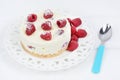 Mini cheesecake with white chocolate and raspberries in a plate