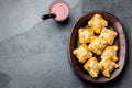 Mini chilean empanadas on clay plate with typical chilean drink vino con harina - red wine with toasted flour Royalty Free Stock Photo