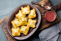 Mini chilean empanadas on clay plate with typical chilean drink vino con harina - red wine with toasted flour Royalty Free Stock Photo