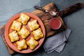 Mini chilean empanadas on clay plate with typical chilean drink vino con harina - red wine with toasted flour Royalty Free Stock Photo