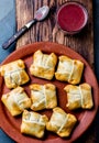 Mini chilean empanadas on clay plate with typical chilean drink vino con harina - red wine with toasted flour Royalty Free Stock Photo
