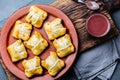 Mini chilean empanadas on clay plate with typical chilean drink vino con harina - red wine with toasted flour Royalty Free Stock Photo