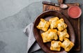 Mini chilean empanadas on clay plate with typical chilean drink vino con harina - red wine with toasted flour Royalty Free Stock Photo